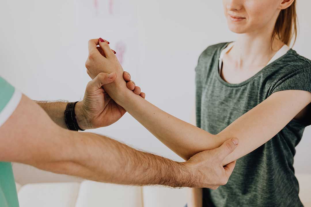 Physical therapist with patient